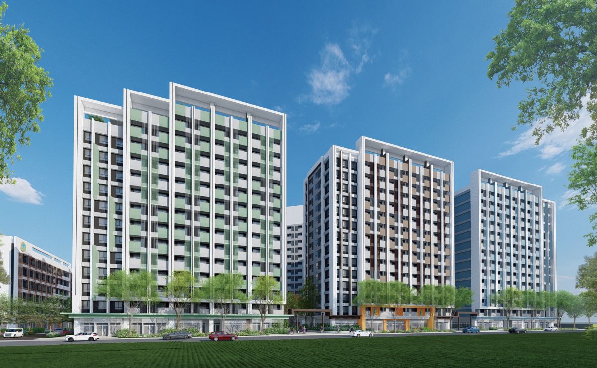 三棟白色立面的集合住宅，前方是一片草地。